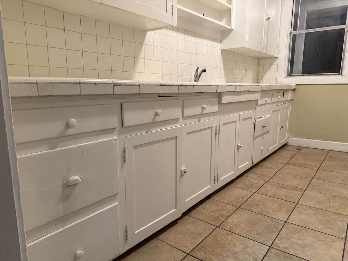 Kitchen cabinets cleaned by Sky House Cleaning, after