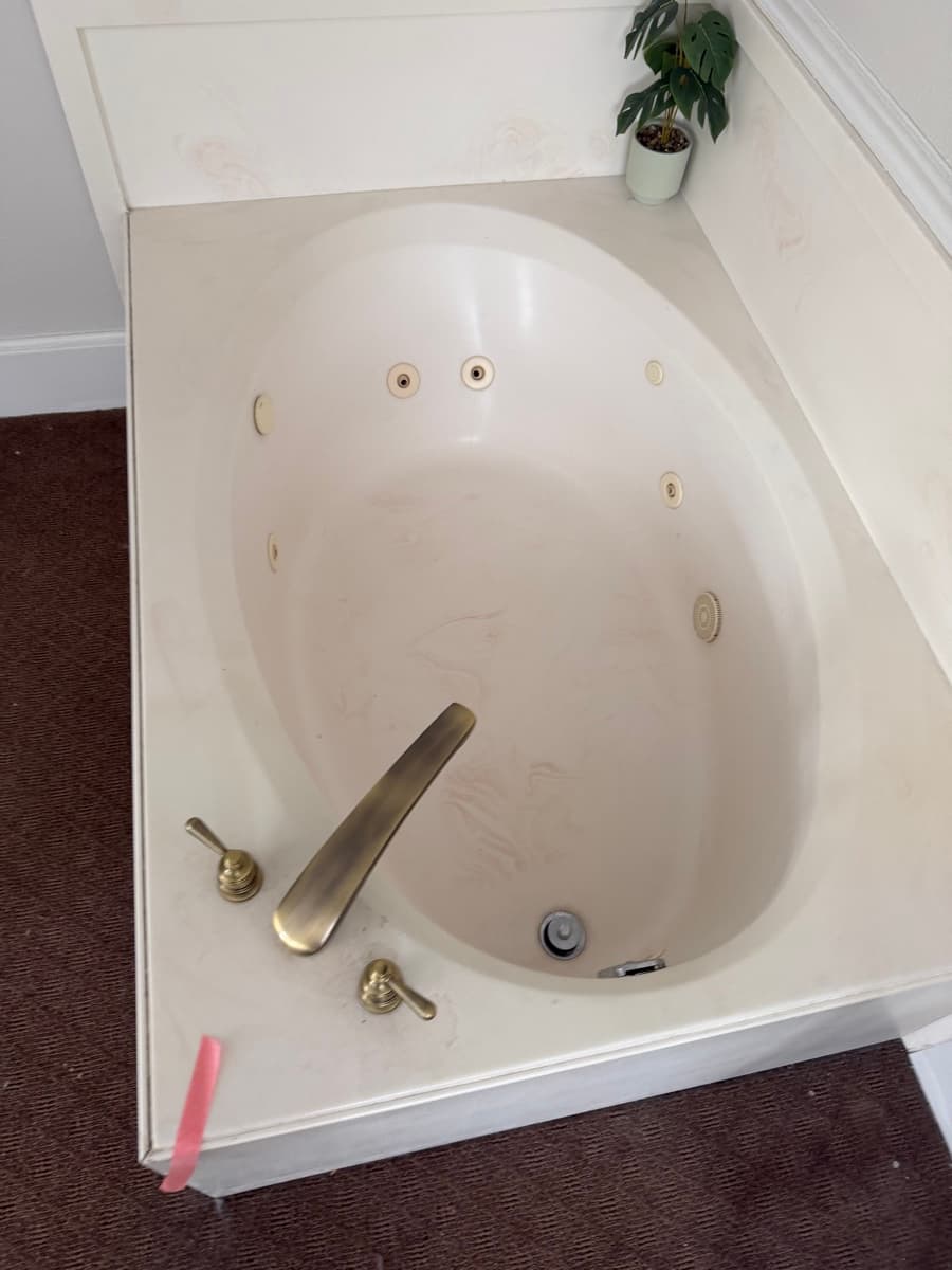 Bathroom tub cleaned by Sky House Cleaning, before