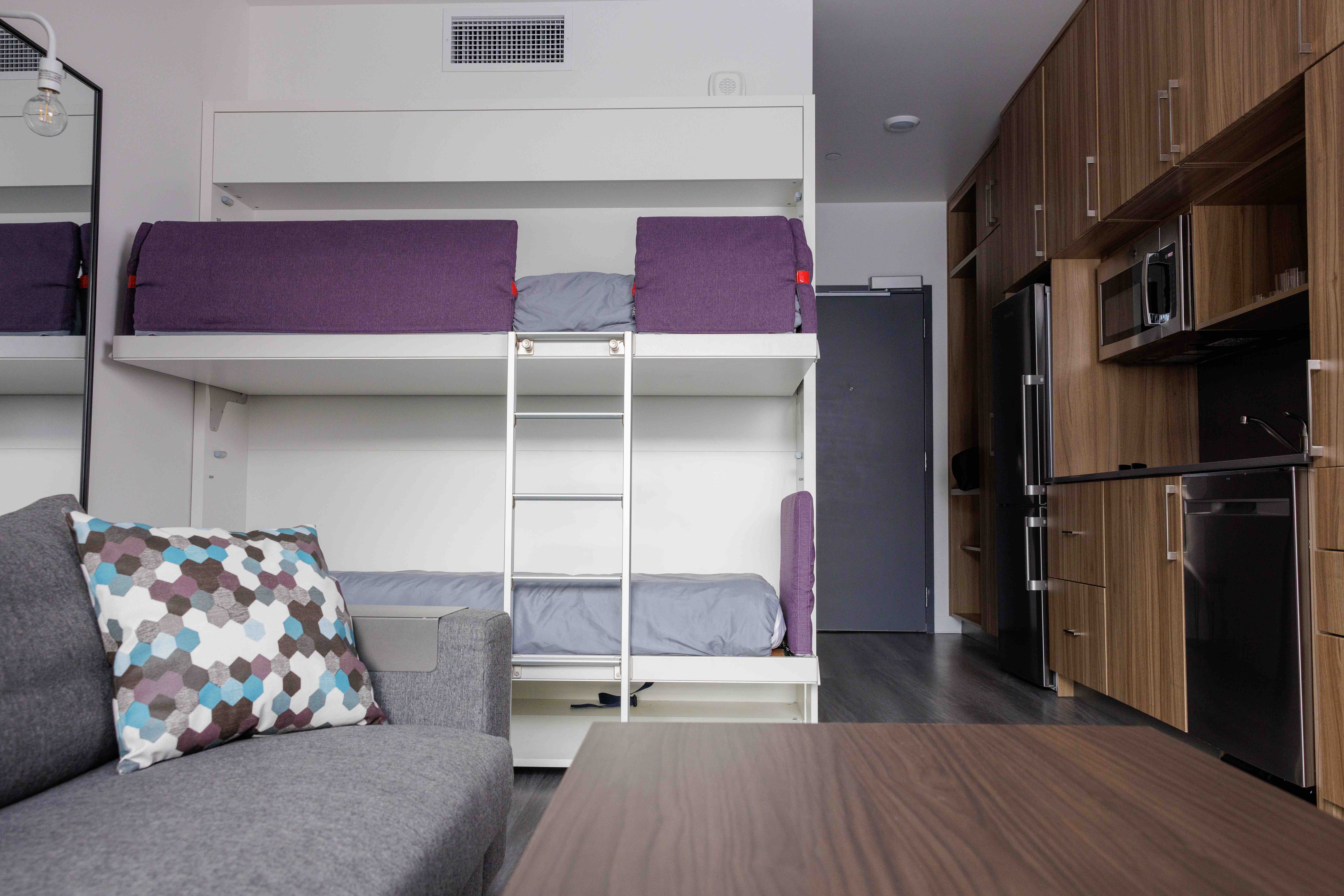 Airbnb studio with a space-saving bunk bed and full kitchen, reset for the next guest