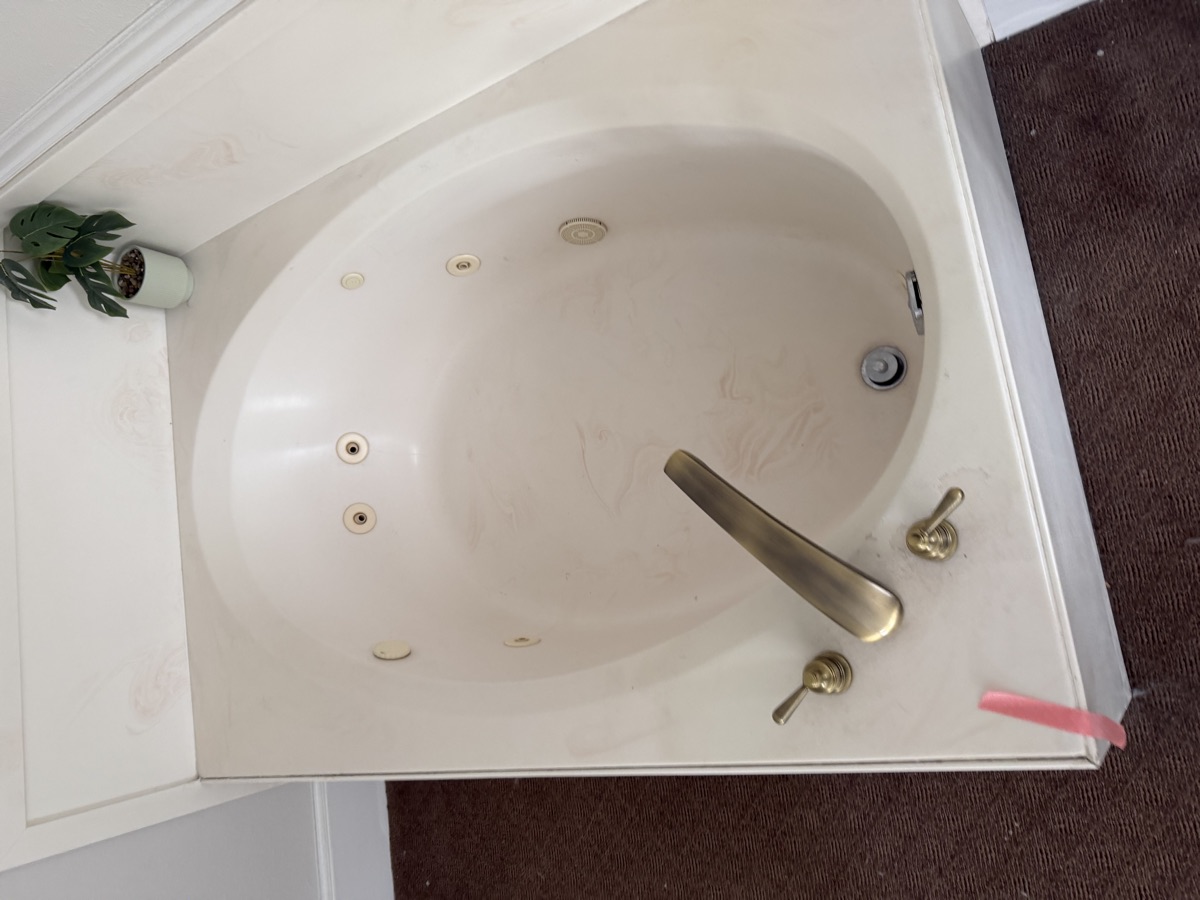 Bathroom tub cleaned by Sky House Cleaning, before
