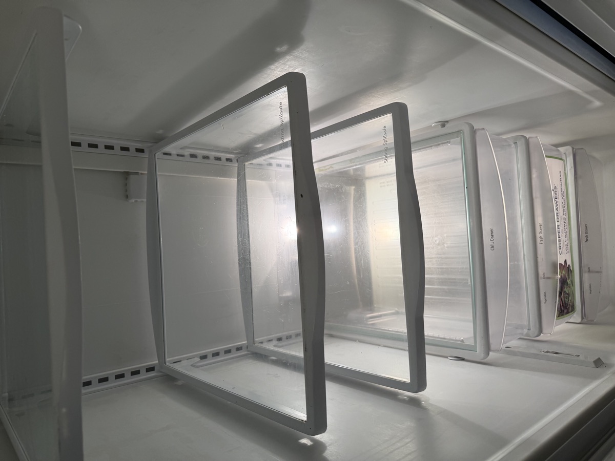 Refrigerator interior cleaned by Sky House Cleaning, before