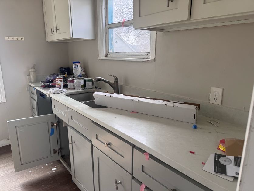 Kitchen cleaned by Sky House Cleaning — before