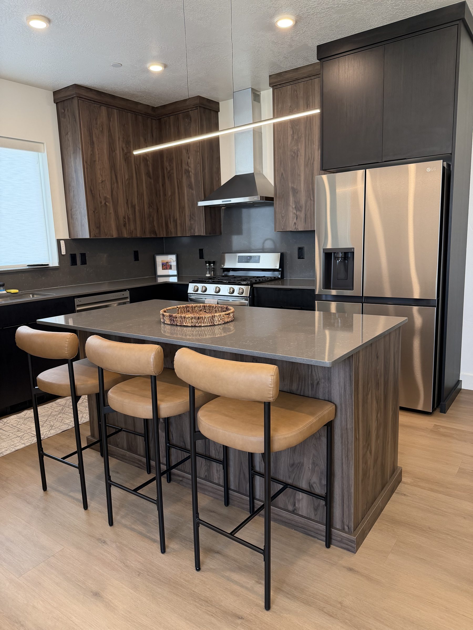 Spotless kitchen island and cabinetry after a Sky House Cleaning visit